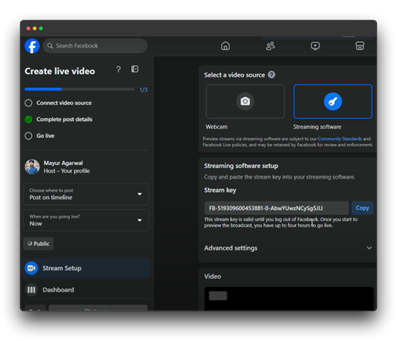 A screenshot of the Facebook Live setup page. The user, Mayur Agarwal, is in the process of creating a live video. The page provides options to select a video source (webcam or streaming software), complete post details, and choose where to post the live video. A stream key is displayed for use with streaming software, and advanced settings are available for customization.