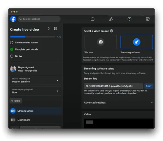 A screenshot of the Facebook Live setup page. The user, Mayur Agarwal, is in the process of creating a live video. The page provides options to select a video source (webcam or streaming software), complete post details, and choose where to post the live video. A stream key is displayed for use with streaming software, and advanced settings are available for customization.
