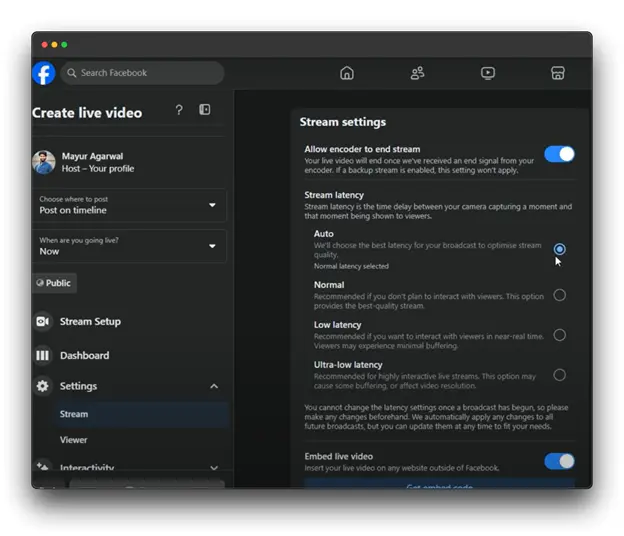 A screenshot of the Facebook Live setup page, specifically showing the stream settings section. The user, Mayur Agarwal, is in the process of creating a live video using streaming software. The page provides options to configure stream settings, including allowing the encoder to end the stream, choosing the stream latency, and enabling or disabling the embedding of the live video on external websites.